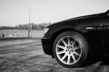 BMW 750Li limousine photographed outdoors. Focus on bumper, towards headlamp.