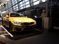BMW M4, front view, yellow color.