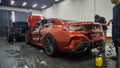 BMW M850i xDrive G15 coupe inside a car garage for installation of paint protection film Royalty Free Stock Photo