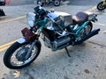 BMW motorcycle: chrome and green in a parking