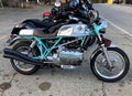 BMW motorcycle: chrome and green in a parking