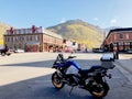 BMW R 1250 motorcycle, parked and in the background the city of Ouray,