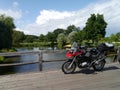 BMW R1200GS motorcycle on a wooden bridge over a river in Slovenia. Royalty Free Stock Photo