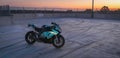 BMW S1000rr Motorcycle in empty carpark at sunset glowing Royalty Free Stock Photo