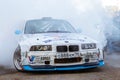 BMW 3-series driftcar burning tires in drift-show Royalty Free Stock Photo