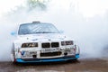 BMW 3-series driftcar burning tires in drift-show Royalty Free Stock Photo