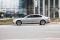 BMW 7 Series F01 on the road in motion. Fast speed drive on city road