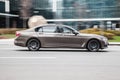 BMW 7 Series G12 on the road in motion. Fast speed drive on city road