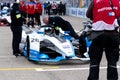 Bmw staff members checking a race car