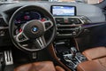 BMW X3 M Competition steering wheel and dashboard. Beige leather car interior. Vehicle interior SUV.