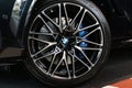 BMW X6 M competition wheel with blue brake caliper, brake disk and a big wheel