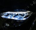 BMW X6M 2017. Headlight of a modern sport car. Front view of luxury sport car. Car exterior details.