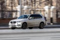 BMW X5 Third generation F15, car driving in city with motion blur, front side view