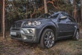 BMW X5 in woods Royalty Free Stock Photo