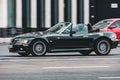 BMW Z3 car rides on street on high speed. Black roadster with inline-six engine in fast motion, side view Royalty Free Stock Photo