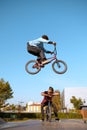 Bmx biker, jump in action, training in skatepark Royalty Free Stock Photo