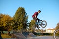 Bmx biker, jump in action, training in skatepark Royalty Free Stock Photo