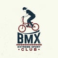 Bmx extreme sport club badge. Vector. Concept for shirt, logo, print, stamp, tee with man ride on a sport bicycle Royalty Free Stock Photo