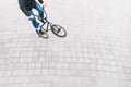 BMX freestyle on the square top view. young man is doing tricks on a BMX bike. BMX culture Royalty Free Stock Photo