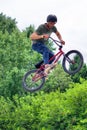 BMX freestyle teenage biker jumping high Royalty Free Stock Photo