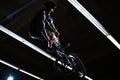 BMX Rider Doing Extreme Tricks on Bike in the Dark Skatepark. Healthy and Active Lifestyle.