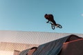 Bmx rider doing trick on ramp in skate park Royalty Free Stock Photo