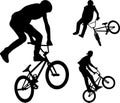 Bmx stunt cyclists silhouettes Royalty Free Stock Photo