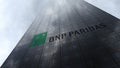 BNP Paribas logo on a skyscraper facade reflecting clouds. Editorial 3D rendering Royalty Free Stock Photo