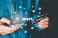 BNPL-Buy Now Pay Later shopping online icon , Online banking businessman using smartphone holding credit card online shopping Royalty Free Stock Photo