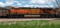 BNSF locomotive 5728 idles in a yard filled with loaded coal hoppers ready for eastbound delivery