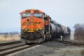 BNSF mixed freight goods train lead by ES44DC locomotive with logo