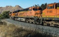 BNSF railroad locomotives pull a freight train upgrade toward the Tehachapi Loop
