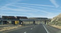 BNSF train over a highway bridge in eastern New Mexico