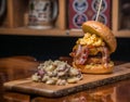 Bodacious Bacon Burger with Macaroni and cheese Royalty Free Stock Photo