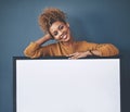 Board, announcement and empty copyspace by a smiling African American young lady. Beautiful, cheerful and happy woman Royalty Free Stock Photo