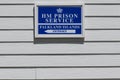 Board with route indicator to Prison Service on Royal Police Station in Stanley, Falkland Falkland Islands