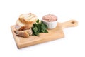 Board with baguette slices, pate and parsley isolated on white background Royalty Free Stock Photo