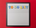 Board with black frame, text To do list in colorful letters, red wall background