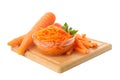 Board and bowl with carrot salad isolated on background Royalty Free Stock Photo
