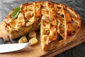 Board with delicious apple pie on grey table, closeup Royalty Free Stock Photo