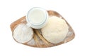 Board with dough, milk and flour on background, top view. Cooking pastries