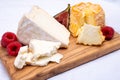 Board with french soft cheeses, Delice de Bourgogne French cow\'s milk cheese from Burgundy