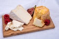 Board with french soft cheeses, Delice de Bourgogne French cow's milk cheese from Burgundy region of France