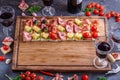 Board full of pinxtos or tapas with jamon, ham and cheese, copyspace Royalty Free Stock Photo