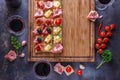 Board full of pinxtos or tapas with jamon, ham and cheese, copyspace Royalty Free Stock Photo