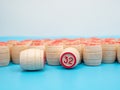 Board game bingo. Wooden barrels with lotto numbers, playing cards for the game.