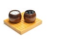 Board Game with black and white stones in bowl called `GO` or weiqi, igo or Baduk with copy space
