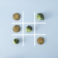 In this board game .broccoli beats chocolate chip cookies, that means healthy food is better than junk food, so win this game. Royalty Free Stock Photo