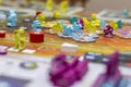 Board game concept. Board game field, many figures, dice and coins Royalty Free Stock Photo