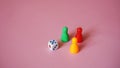 Board game figures and one dice Royalty Free Stock Photo